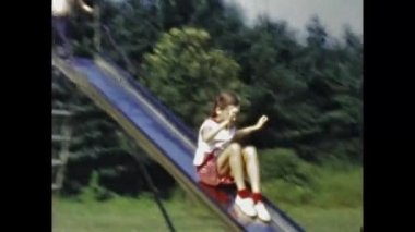 San Diego, United States may 1947: Children on the slide in the 40s scene