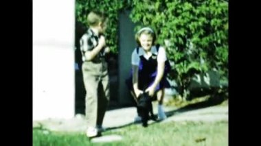 San Diego june 1947: Kids Stroking the cat in the 40s scene