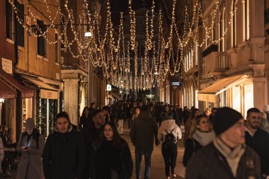 Venice, Italy 6 January 2023: Crowd of people in Venice scene at night