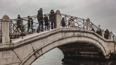 Venice, Italy 6 January 2023: People walking Venice bridge scene