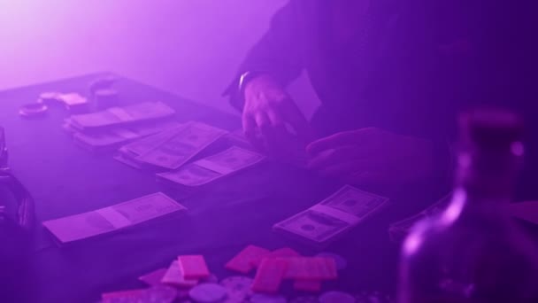Young Man Packs Money Dimly Lit Nightclub Puts Briefcase Gambling — Stok video