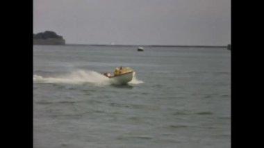 Copenhagen, Denmark may 1968: A vintage video of a speedboat racing on the sea in the 60s