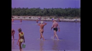 Pakostane, Croatia May 1968: Relive the golden moments of family beach vacations in the 70s with this vintage video footage. Featuring scenic views of the ocean and happy families playing together