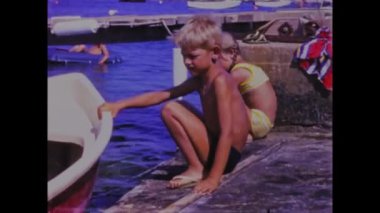 Pakostane, Croatia May 1968: Relive the golden moments of family beach vacations in the 70s with this vintage video footage. Featuring scenic views of the ocean and happy families playing together