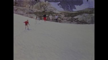 Dolomites, Italy May 1968: Take a trip back in time with this vintage video of a family vacation in the beautiful Dolomites. Relive memories from the 70s and admire the stunning mountain landscapes.