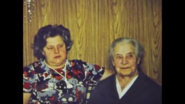 Stuttgart, Germany may 1975: Relive the good old days with this vintage video of a 70s home dinner party, capturing the joy and togetherness of friends and family.