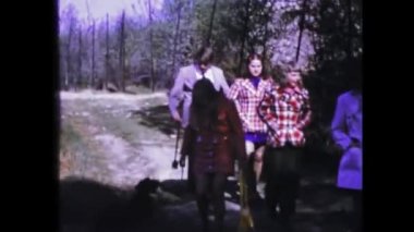 Dolomites, Italy may 1975: A historic video showing people walking on a country path in the 1970s
