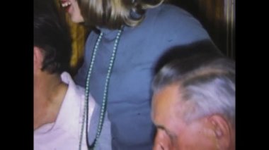 Dolomites, Italy may 1975: A nostalgic video of a group of people having lunch together, reminiscent of home memories from the 1970s