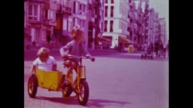 Rimini, Italy june 1975: A throwback video capturing the joy and innocence of children riding bicycles in the 1970s. Revisit old memories and feel the nostalgia with this vintage clip.