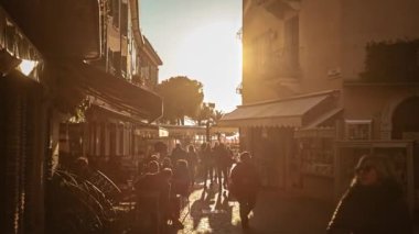Sirmione, Italy 16 February 2023: Charming historic center of Sirmione, a popular tourist destination on Lake Garda in Italy, bustling with visitors exploring its narrow streets and ancient buildings.