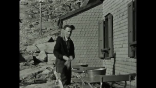 Dolomites Italy June 1955 50S Footage Stern Man Meticulously Arranging — Stock Video