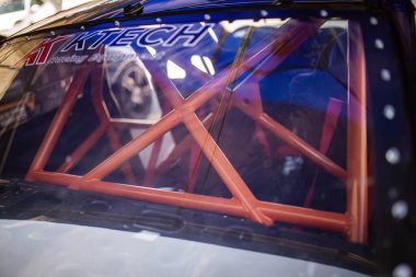 Rome, Italy 18 April 2024: Close-up photo of a sturdy rollbar installed in a high-performance racing car for safety. clipart