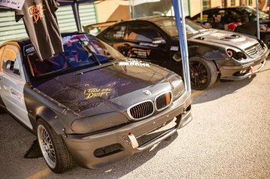 Photo featuring cars showcased at an automotive tuning event. clipart