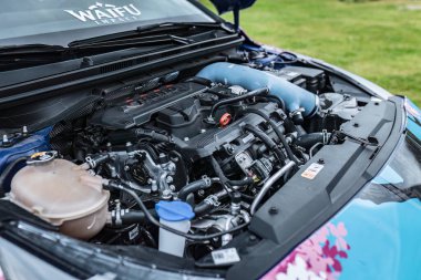 Gavello, Italy 23 june 2024: Detailed view of a tuned Hyundai i20 N engine, showcasing aftermarket modifications and components clipart