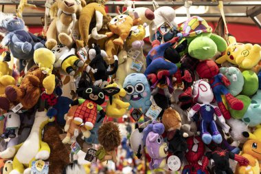 Rovigo, Italy 24 October 2024: A variety of plush toys are hanging from the ceiling of a toy store, creating a fun and colorful atmosphere clipart