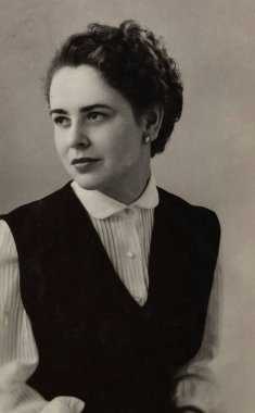 Rome, Italy may 1964: Black and white portrait of a stylish woman wearing a vest and collared shirt, representing office fashion from the mid-20th century clipart