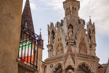 Verona, Italy 1 January 2025: The scaliger tombs, a group of gothic funerary monuments in verona, showcase ornate details and italian flag clipart