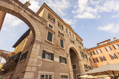 Verona, Italy 1 January 2025: Palazzo maffei with its baroque facade and clock tower overlooking piazza delle erbe in verona, italy clipart