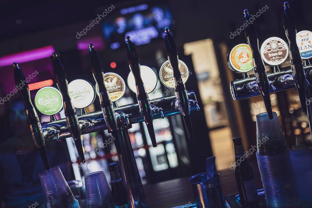 Rome, italy 4 may 2025: many different beer brands are available on tap, waiting for thirsty customers in a bar