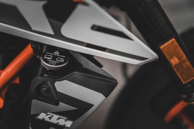 Padova, italy 1 october 2025: ktm motorcycle radiator cap and engine close-up highlighting precise engineering and sportbike performance details