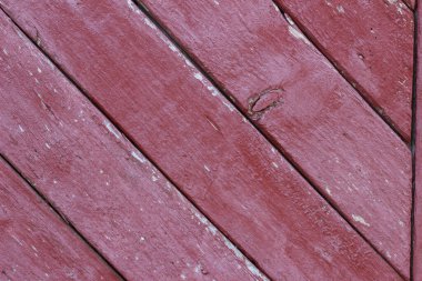 Kırmızıya-kahverengiye boyanmış eski ahşap ahşap döşemeler.