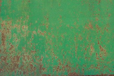 Paslı, eski bir boyanın kabuğu soyulmuş ve soyulmuş metal bir yüzey.