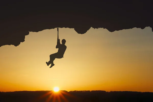 Man rock climber silhouette, adventure experiences concept