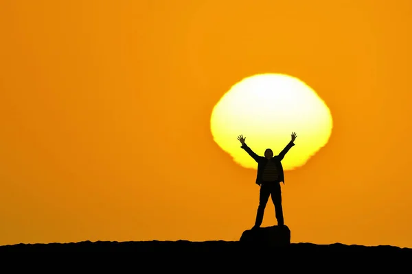 Man Stands His Hands Held High Front Breathtaking Orange Sky — Stock Photo, Image