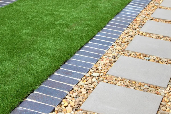 Modern Backyard Details Combining Artificial Grass Gravel Paving Slabs Royalty Free Stock Photos
