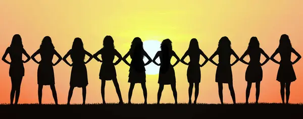 Silhouettes Young Women Stand Elbow Elbow Forming Line Backdrop Breathtaking Stock Photo