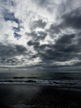 Photographic documentation of the arrival of black clouds in the pre-storm phase over the sea 