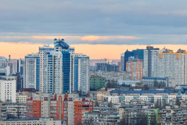 Modern architecture of new buildings with solar panels to save eco-friendly energy and heat. The concept of green energy in a modern metropolis.