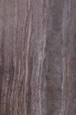 Dikey çizgili koyu kahverengi mermer levhanın dokusu ve arkaplanı.