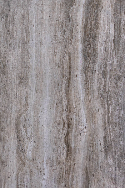 Surface and texture of smoky granite with vertical stripes and blotches. Natural gray texture and background. Vertical image.