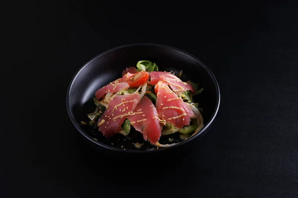 Japanese salad isolated in black background