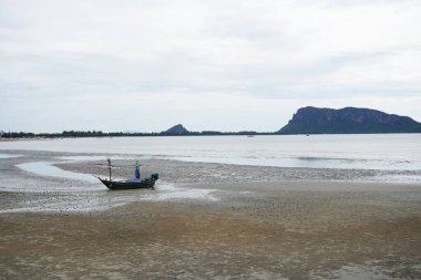 Summer beach along the coast during low tide. Prachuap Khiri Khan Province, Thailand	