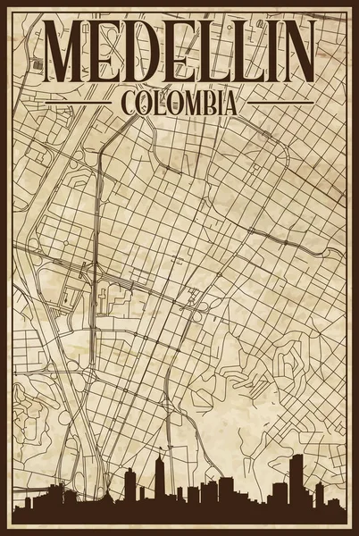 街のスカイラインとレタリングが強調されたコロンビアのダウンタウンMedellinの茶色のヴィンテージ手描きのプリントアウトストリートネットワークマップ — ストックベクタ