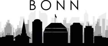 BONN, ALMANY 'nin arka planında gri sisli şehir binalarıyla siyah şehir manzarası gökyüzü manzarası