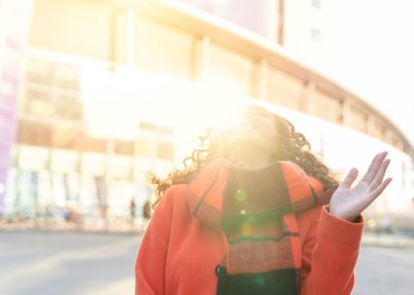 Outdoor portrait of an huppy and laughing woman  visiting a Europe city
