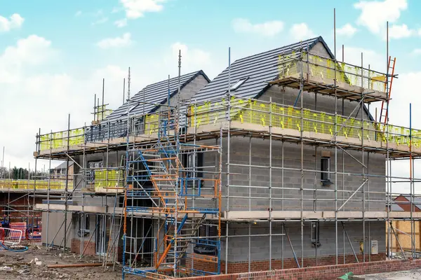 Scaffolding erected around houses in a new housing development