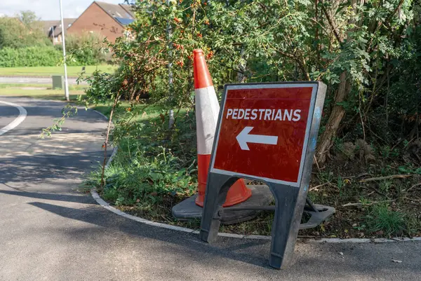 pedestrian sign due to road repairs