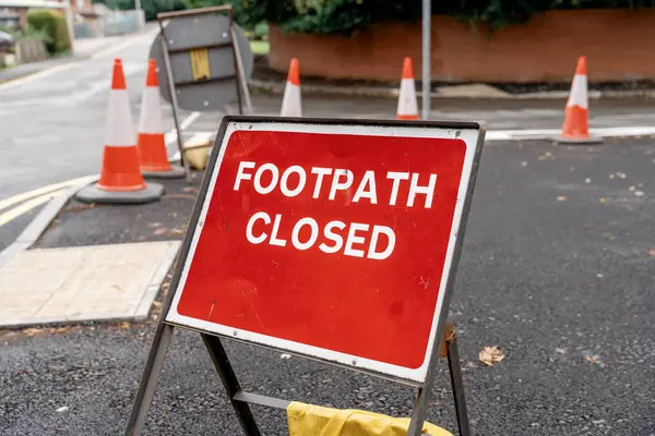 footpath closed sign due to road repairs