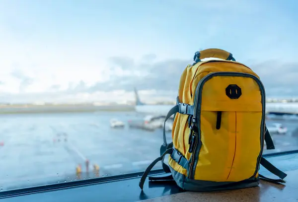 stock image Yellow rucksack in airport. Travel concept. Travel touristic concept. travel light