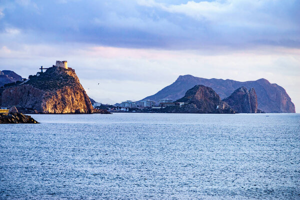 Spanish coastal landscpae with castle San Juan on cliff, Aguilas, Murcia region, Spain.