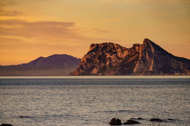 Gibraltar rock, british overseas territory on spanish coast. View from Torrecarbonera beach, Punta Mala, Andalusia Spain. Tourist attraction. clipart