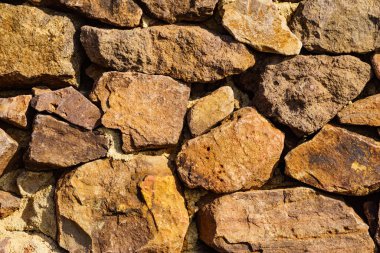 Taş duvar. Kahverengi arkaplan dokusu
