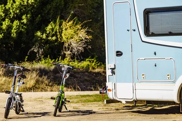 Camper Recreational Vehicle Two Electric Bicycles Camping Nature Holidays Travel 스톡 이미지
