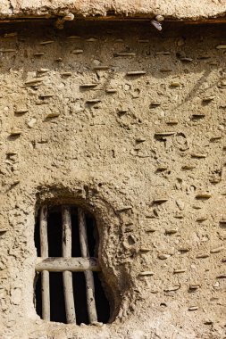 Old clay house detail, bars in window. El Chorrillo film location, Sierra Alhamilla in Andalucia Spain. clipart