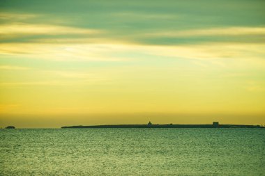 Coastal landscape in south Spain, mediterranean sea coast on the Costa Blanca, Santa Pola island Tabarca on horizon clipart