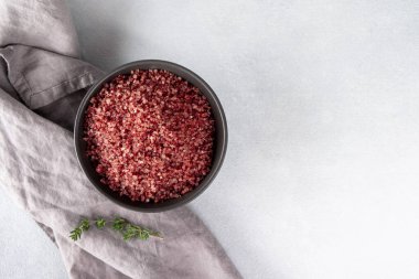 Red wine flavored salt in a bowl. Gourmet condiment to aromatize and season food Dessert, Seafood, Meats, Pasta, Sauce, Finishing Salt